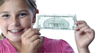 young girl with five dollar bill in her hands