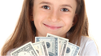 smiling young girl with fan of dollar bills