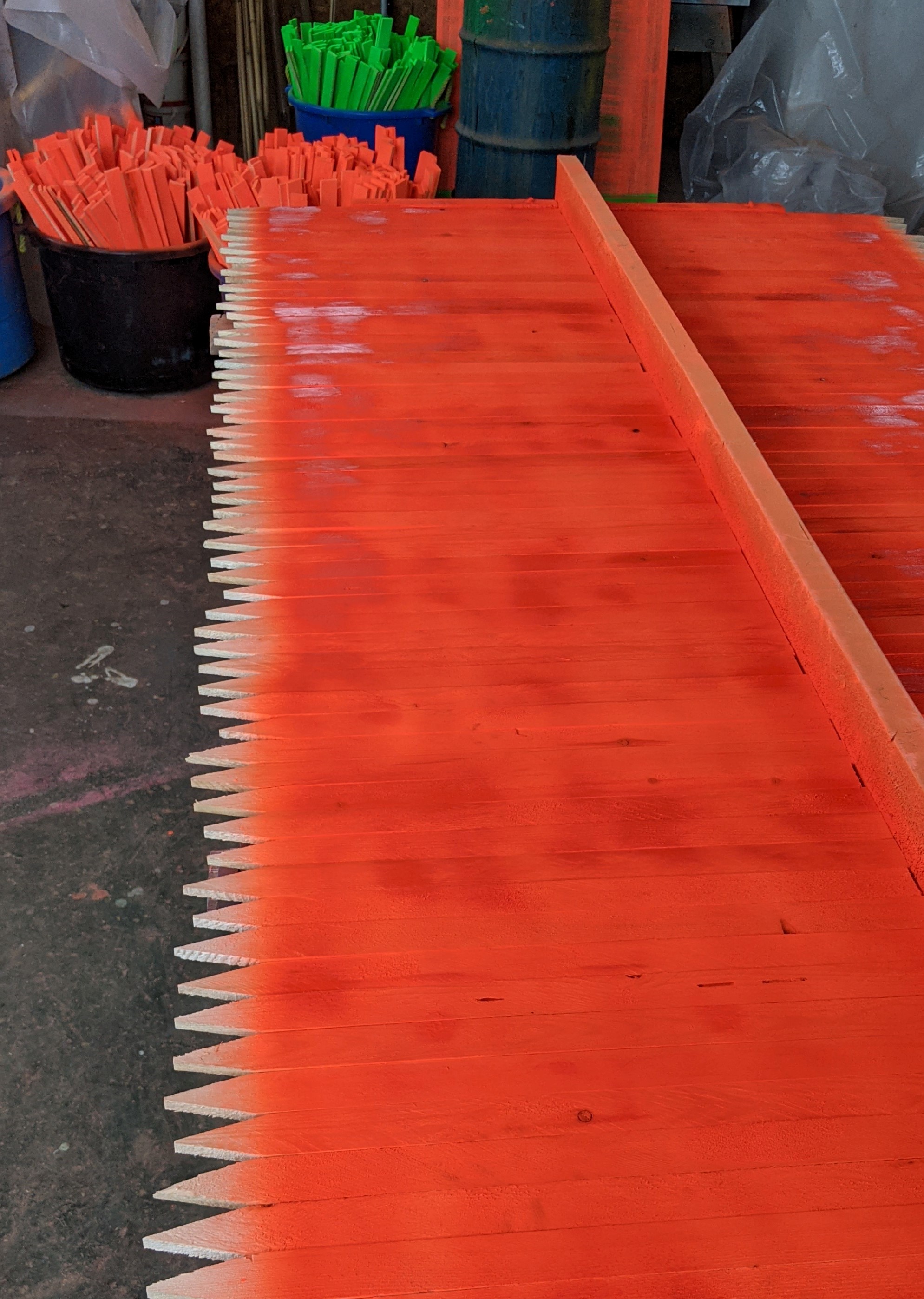 Orange painted wood stakes