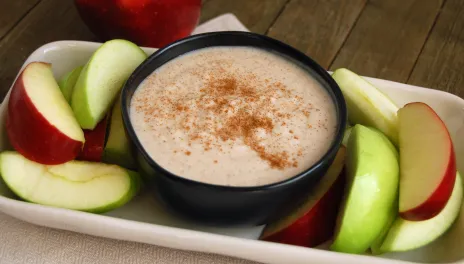 bowl of honey yogurt fruit dip with apple slices