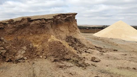 Piles of uncovered feedstuffs