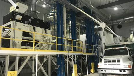 The Carrington Research Extension Center seed mill has several cleaners, sorters, and air handlers enclosed in a building large enough to accomodate a grain truck.