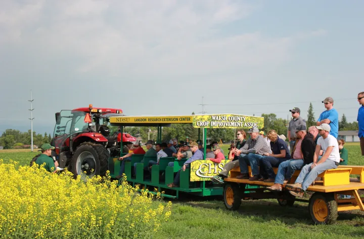 Picture of people sitting on the peoplecarriers at an annual LREC Field Day event.