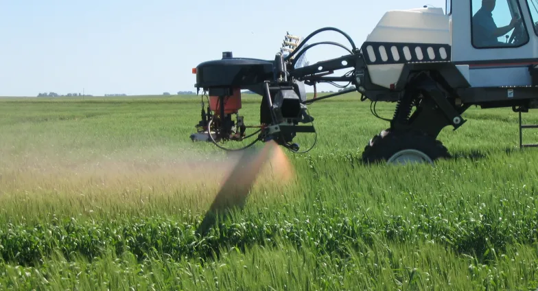 crop sprayer spraying field