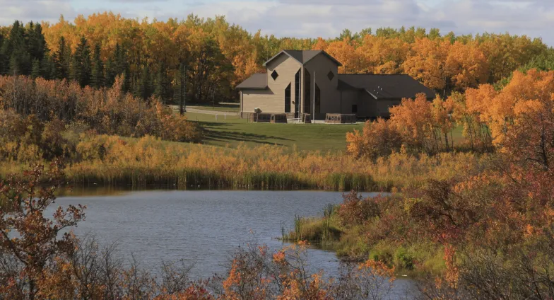 large building by a pond 