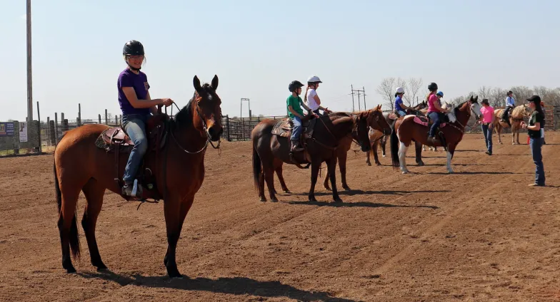 4-H youth riding horses