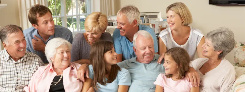 Family members sitting on a couch conversing