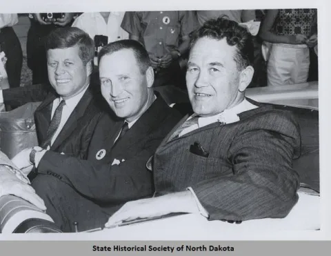 JFK, Governor Guy and Quentin Burdick in a car posing