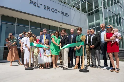 Peltier Family in front of Peltier Complex