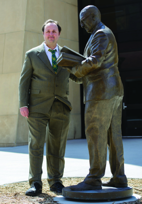 Ben Bernard standing with finished statue