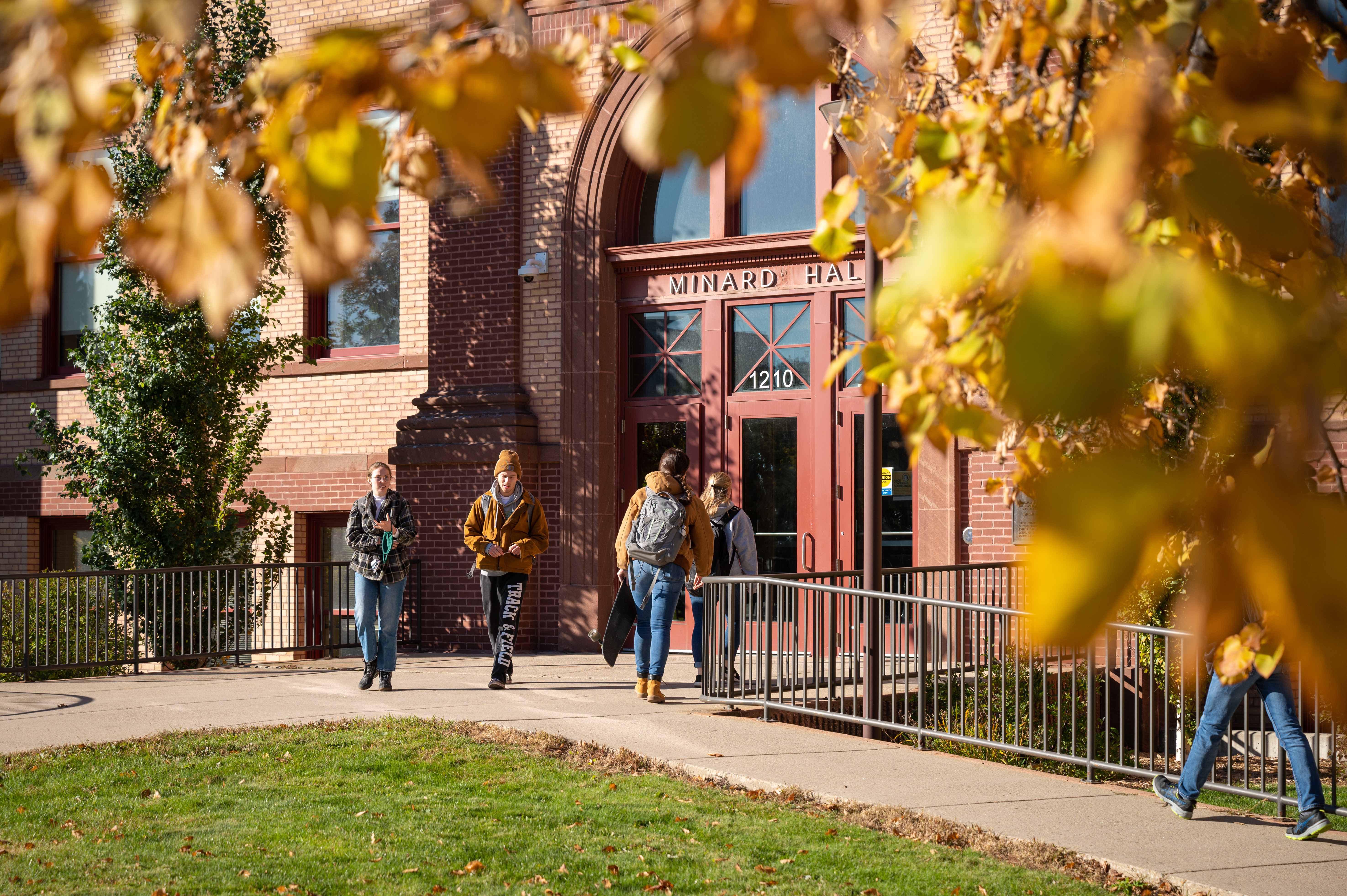 Students leaving academic building in fall