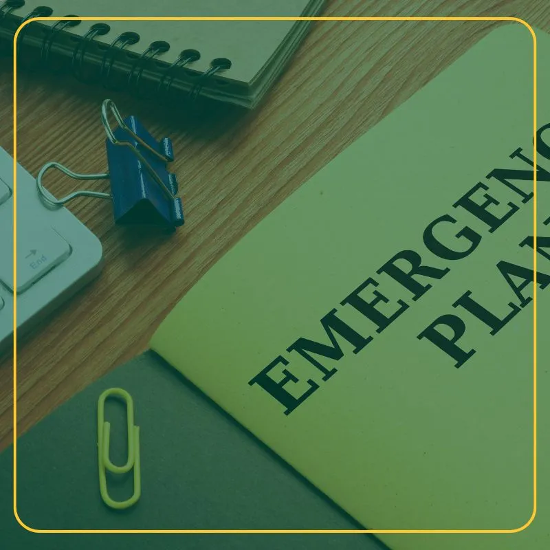a notebook and binder on a desk with the words Emergency plan