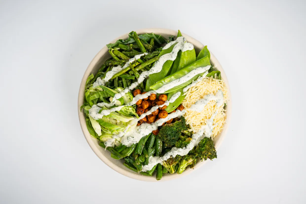 green salad featuring a variety of fresh vegetables