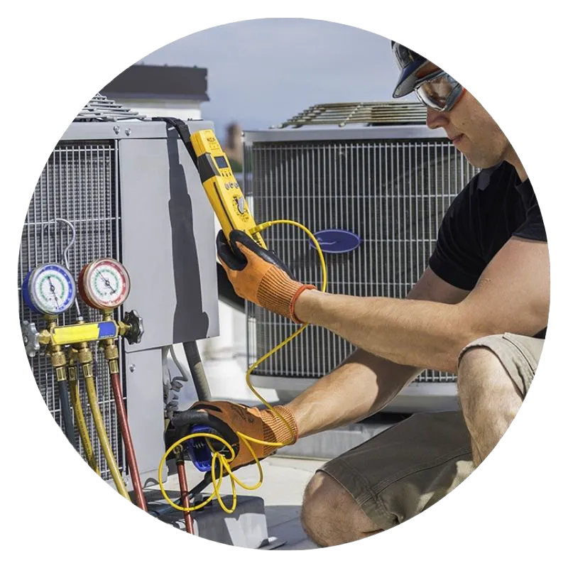 individual working on an air conditioner